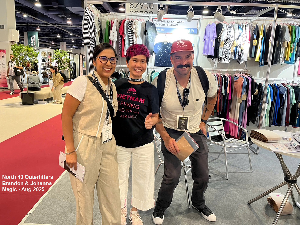 A trade show booth for the Vietnam Textile and Apparel Association at Sourcing at Magic 2011, featuring clothing displays with various garments.